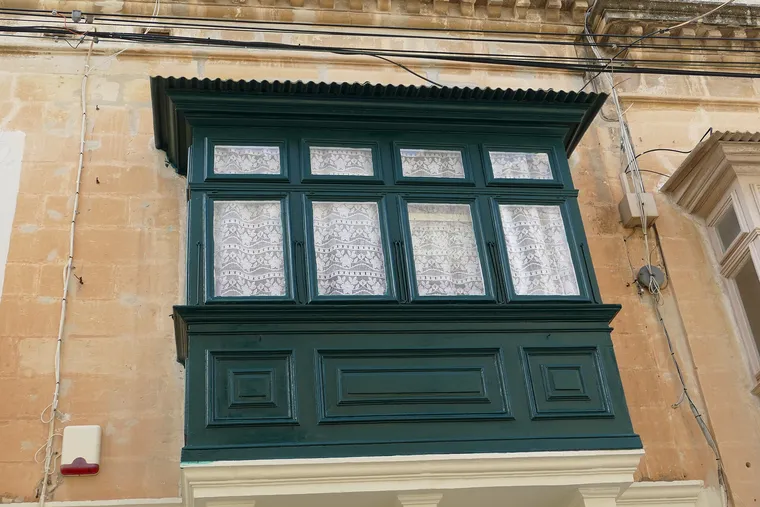Traditional Maltese balconies on a townhouse façade in Rabat